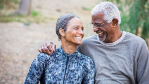 Stock photo of a couple walking on a trail.