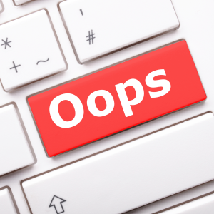 Graphic image of a stock photo of a keyboard and a red button that says "Oops"