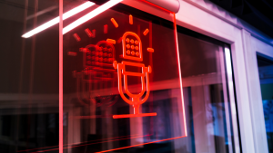 Graphic of a red microphone affixed to a clear piece of glass