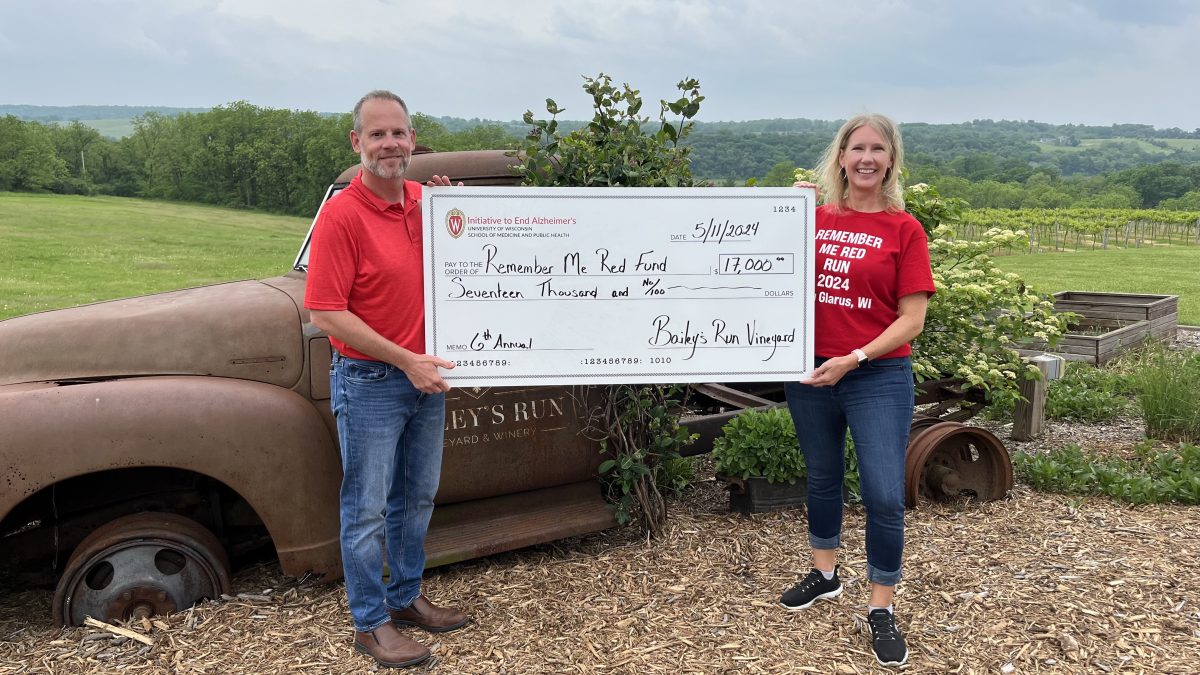 Snapshot of Steve Ramig and Janet Kuehl holding a giant check written out for $17K
